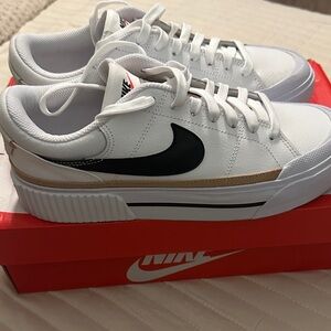 Nike White and Black Sneakers with Gold Accents